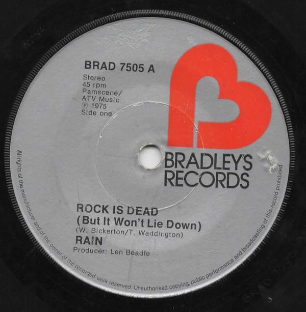 Rain  - Rock Is Dead (But It Won't Lie Down)